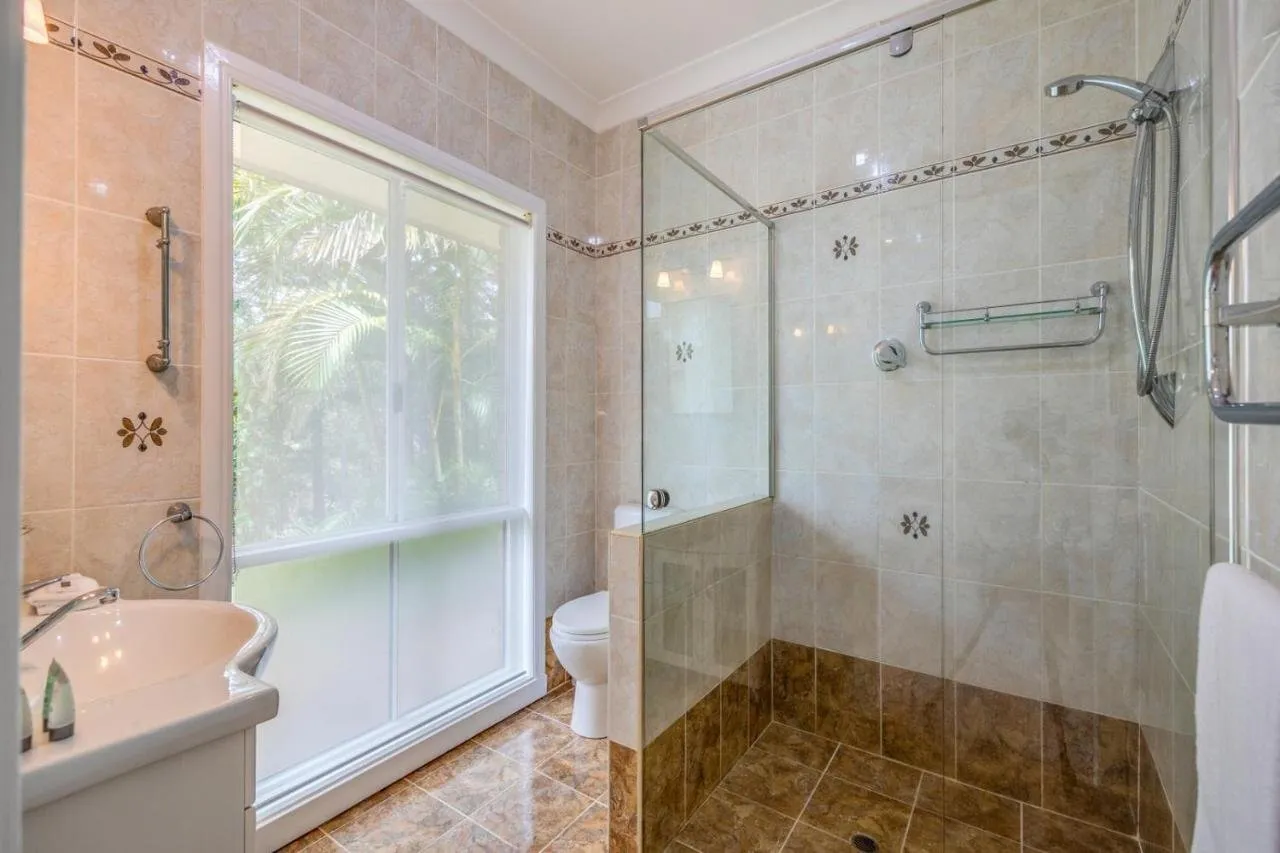 Bathroom with walk-in shower and garden window