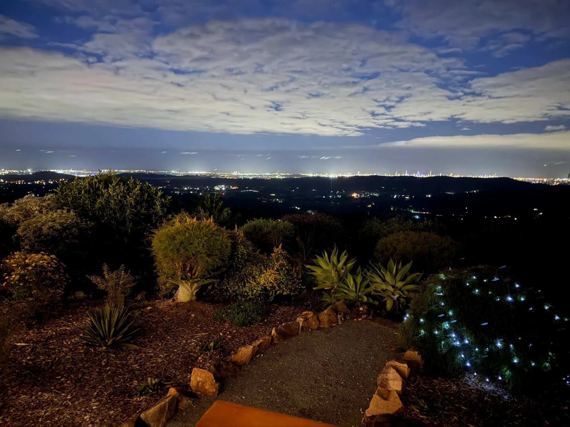 Gold Coast skyline lit up at dusk, seen from the mountain