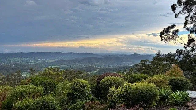 Dusk over the valley with storm clouds