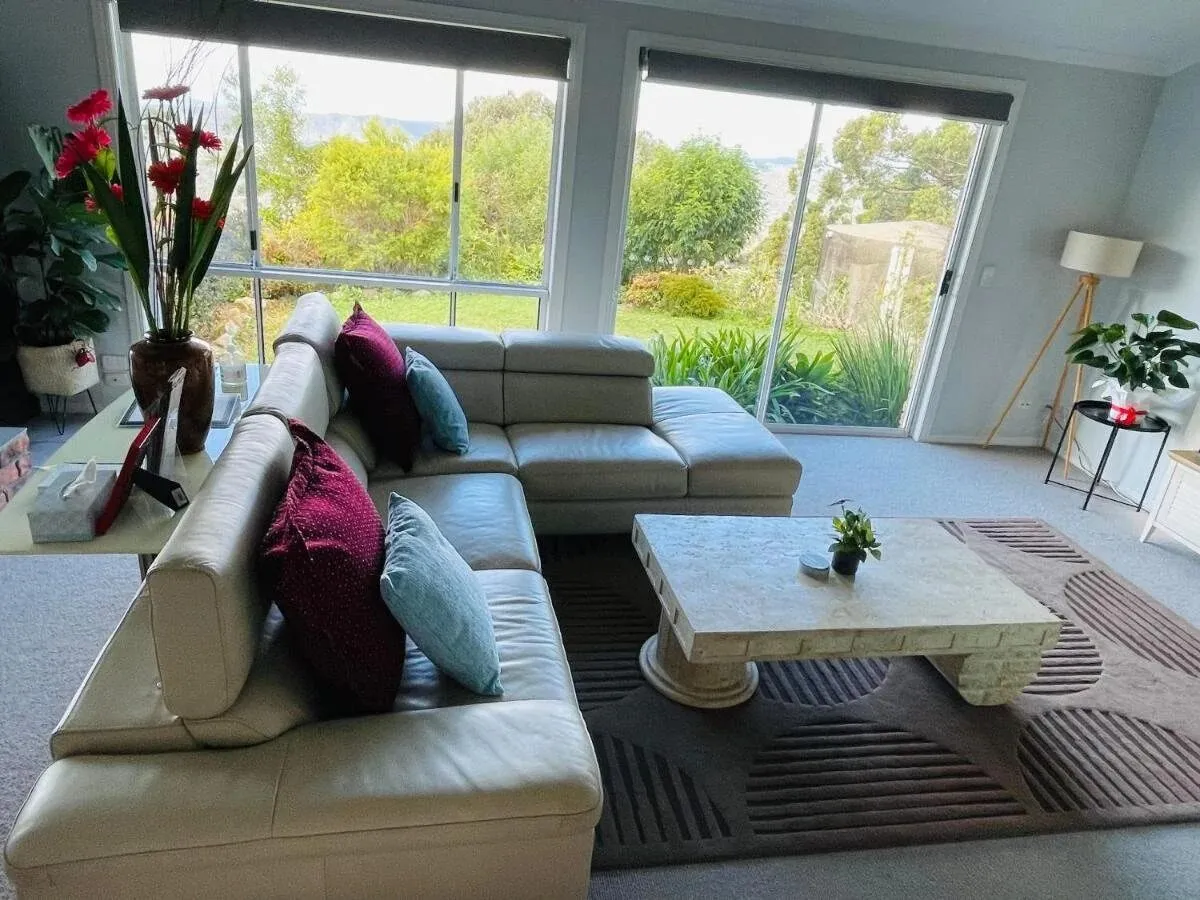 Lounge with corner sofa and garden view windows