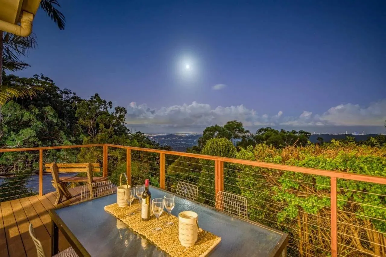 Outdoor dining under a full moon over the valley