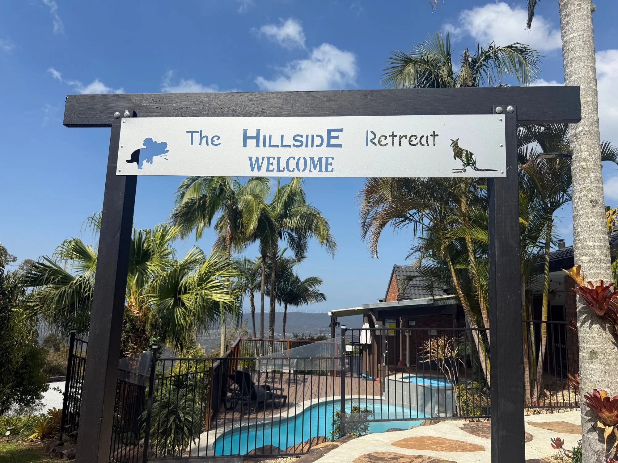 The Hillside Retreat welcome sign at the entrance