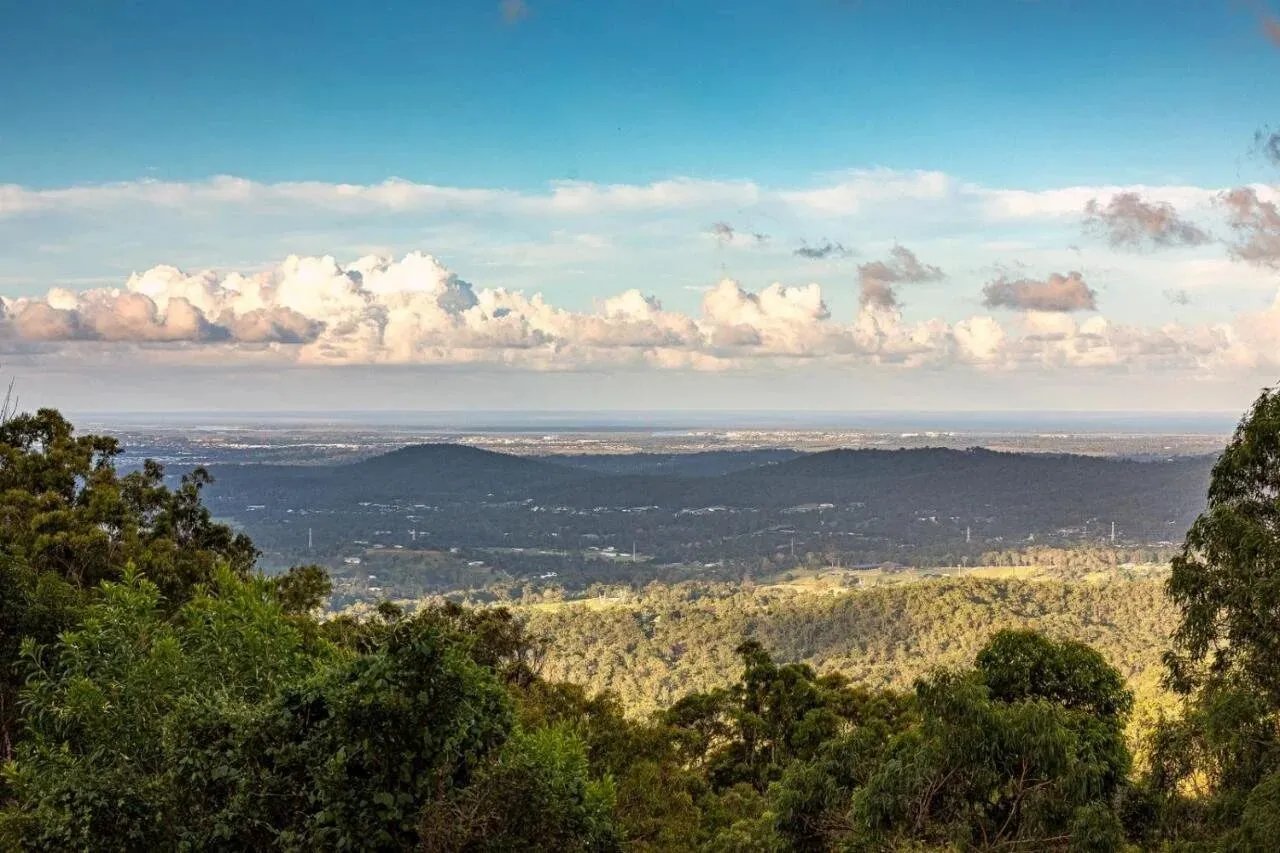 Valley view with clouds over the distant coastline