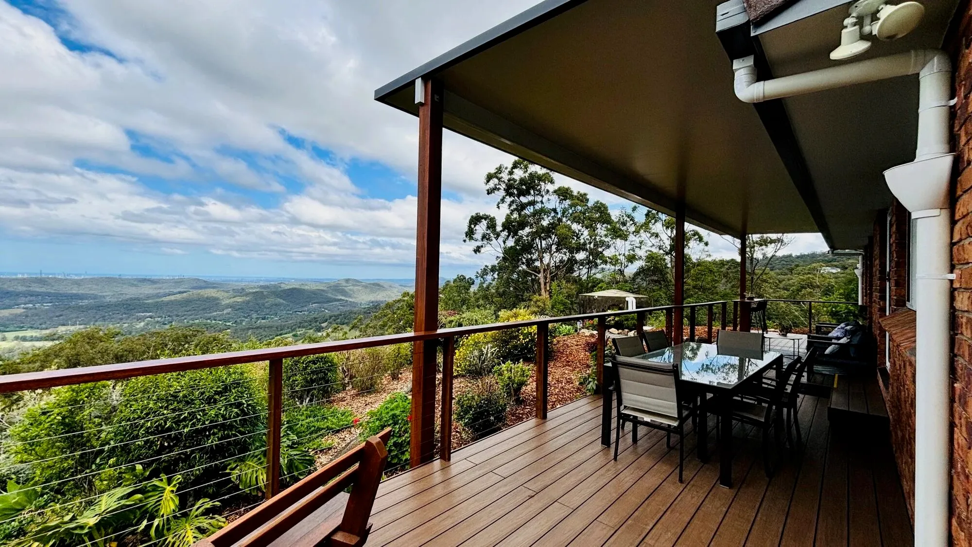 Verandah dining table with sweeping hinterland views